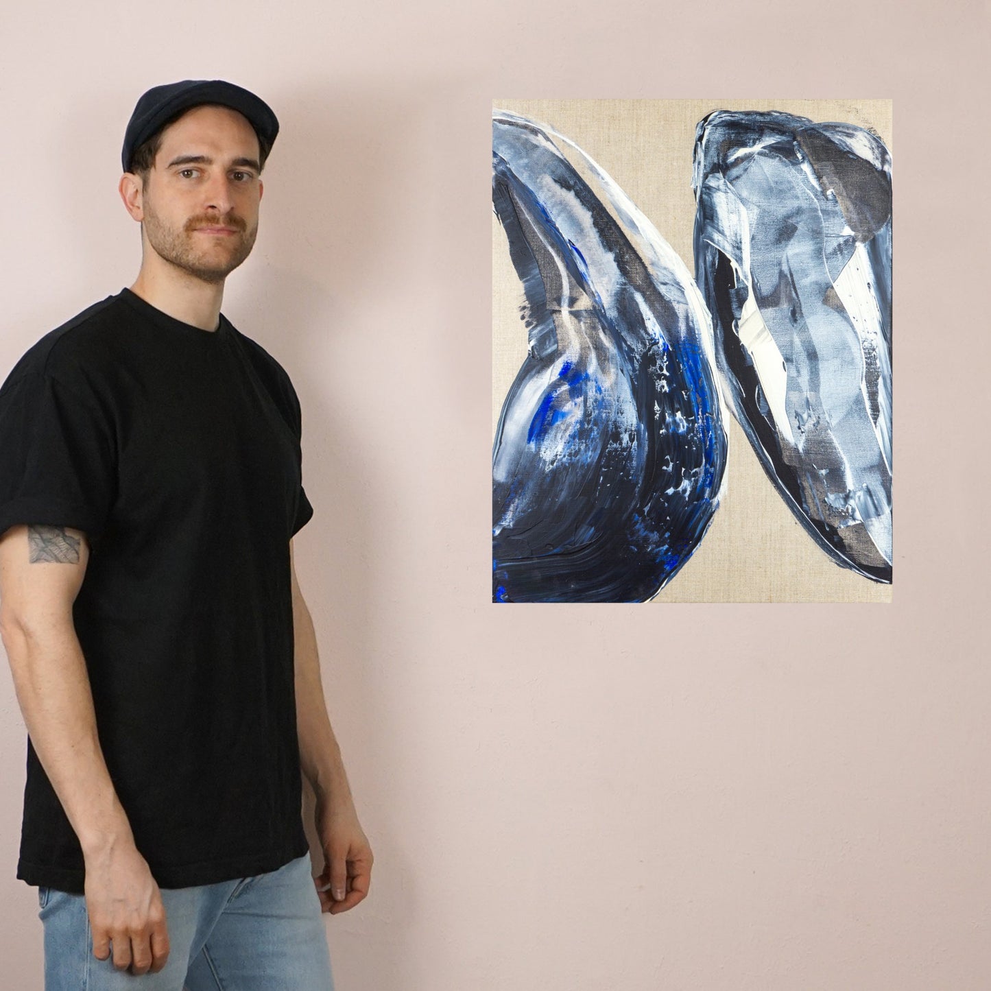Max Lanzinger standing next to abstract fine art print.