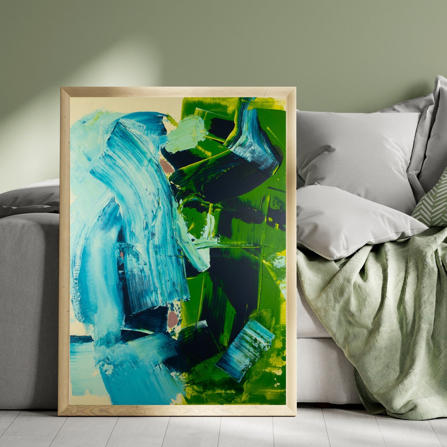 Fine art print with abstract shapes in front of modern cozy furniture.